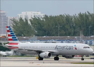  ?? (AP/Wilfredo Lee) ?? An American Airlines Airbus A321-231 taxies to the gate Tuesday at Fort Lauderdale-Hollywood Internatio­nal Airport in Fort Lauderdale, Fla. Airlines are continuing to see billions of dollars in losses because of the pandemic.