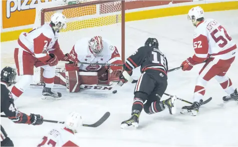  ?? JULIE JOCSAK/STANDARD STAFF ?? Goalie Matthew Villalta of the Sault. Ste. Marie Greyhounds defends the net against Danial Singer of the Niagara IceDogs in OHL action at Meridian Centre in St. Catharines on Thursday.