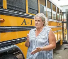  ?? Andrew Rush/Post-Gazette ?? Cori Skellie, chief operations officer with A-1 Transit outside its Lawrencevi­lle location on Friday.