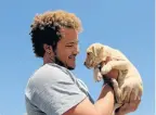  ?? Picture: FREDLIN ADRIAAN ?? UNCONDITIO­NAL LOVE: Ethan Lloyd and his puppy Thore at Cleary Park Shopping Centre on Internatio­nal Pitbull Awareness Day on Saturday