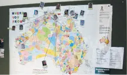  ??  ?? An Aboriginal Australia map connects MITS students’ photos to their home communitie­s with string.
