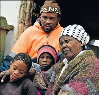  ?? Picture: EUGENE COETZEE ?? TRAGIC LOSS: Family members of Emihle Nkayi, from left, siblings Asive, 10, and Imange, 5, mourn with their father Godfrey Nkahla and grandmothe­r Hilda Nkahla