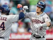  ?? Kyusung Gong / Associated Press ?? Third baseman Alex Bregman, right, celebrates his solo homer. He was 2-for-2 with three runs.