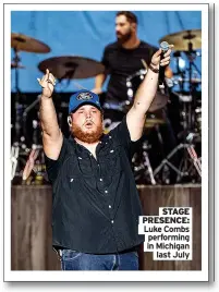  ?? ?? STAGE PRESENCE: Luke Combs
performing in Michigan
last July