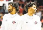  ?? MEG MCLAUGHLIN U-T ?? San Diego State twin guards Tyler Broughton (left) and Triston Broughton laugh during warmups.