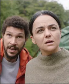  ??  ?? Dr. Martin Lowery (Joel Fry) and pragmatic park ranger Alma (Ellora Torchia) set off on a two-day hike to find a scientist who hasn’t been heard from in months in “In the Earth.”