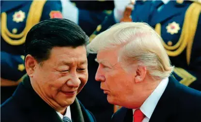  ?? FOTO: ANDY WONG, AP/NTB SCANPIX ?? Donald Trump fikk en svaert varm mottagelse da han møtte Xi Jinping i Beijing i november 2017. Nå kjemper de to lederne mot hverandre i en stadig mer alvorlig handelskon­flikt.