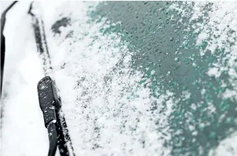  ?? GETTY IMAGES FILES ?? Winter can wreak havoc on visibility when you’re driving, so make sure your windshield is always clear.