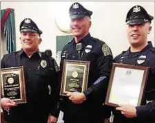  ?? SUSAN L. SERBIN — DIGITAL FIRST MEDIA ?? Media police officers received awards at council’s March meeting. From left, Officer Richie Leicht was presented the Tom Flynn Memorial Officer of the Year Award; Officer Eric Gavin was selected Supervisor of the Year. Both awards given by Nativity BVM...