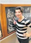  ?? SUBMITTED ?? Sara-Jeanne Hosie points to a photo of her father, Bill, in the backstage wall of fame of past production­s at the Charlottet­own Festival.