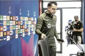  ?? FOTO: PERE PUNTÍ ?? Xavi Hernández, a su llegada a la sala de prensa Se le vio muy animado