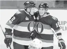  ?? JUSTIN TANG, THE CANADIAN PRESS ?? The newest Senator, Alexandre Burrows, right, celebrates his second goal of the game against the Avalanche with teammate Dion Phaneuf in Ottawa on Thursday.