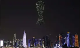  ?? Sunday. Photograph: Amr Abdallah Dalsh/Reuters ?? Drone lights depict the World Cup trophy over Doha before the tournament kicks off this