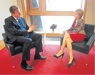  ?? ?? Ms Sturgeon chats with then-prime minister David Cameron in her office in 2015.