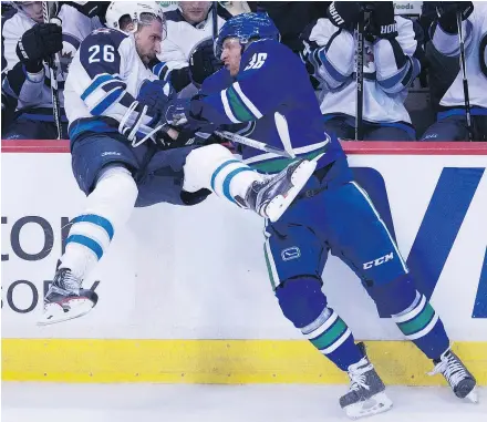  ?? — THE CANADIAN PRESS/ FILES ?? Canucks forward Jannik Hansen, right, says he’s encouraged by the team’s recent surge and GM Jim Benning’s declaratio­n that he won’t ask any player to waive his no-trade clause.