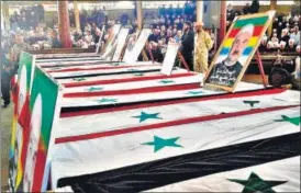  ?? AP ?? Mourners attend a mass funeral of people killed by the Islamic State attacks in Sweida.