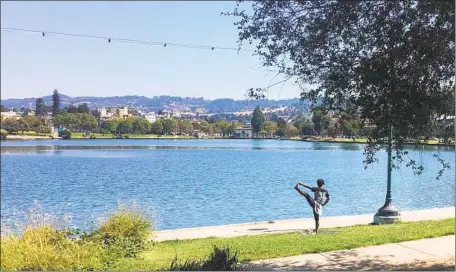  ?? Maura Dolan Los Angeles Times ?? AFTER BEING sealed off to prevent overcrowdi­ng over the weekend, Oakland’s Lake Merritt reopened Monday, attracting a few people out for some exercise on a sunny day. The number of vendors around the lake has “exploded” in the last five weeks, a city official said.