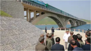  ?? (KCNA/Reuters) ?? NORTH KOREAN LEADER Kim Jong Un inspects the completed railway that connects Koam and Dapchon.