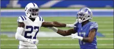  ?? TONY DING — THE ASSOCIATED PRESS ?? Indianapol­is Colts cornerback Xavier Rhodes (27) keeps contact with Detroit Lions wide receiver Marvin Hall (17) during the second half of Sunday’s game in Detroit.