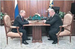  ?? ALEXEI NIKOLSKY SPUTNIK ?? Russian President Vladimir Putin, left, named Mikhail Mishustin as prime minister Thursday.