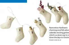 ?? RH BABY & CHILD VIA AP ?? Restoratio­n Hardware’s charming wool felt advent calendar stocking garland, which is a clever way to count down the days to Christmas.