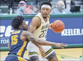  ?? James Franco / Special to the Times Union ?? Siena junior Jalen Pickett works against Canisius senior Majesty Brandon. Canisius’ forced Siena into 16 turnovers Thursday.