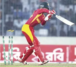  ??  ?? DHAKA: Zimbabwe’s Sean Williams is bowled out by Bangladesh’s Al-Amin Hossain during their second Twenty20 internatio­nal cricket match in Dhaka, Bangladesh, yesterday. — AP