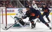  ?? JASON FRANSON — THE CANADIAN PRESS VIA AP ?? Sharks goalie James Reimer (47) makes a save against Edmonton Oilers' Jesse Puljujarvi (13) during secondperi­od in Edmonton, Alberts on Thursday.