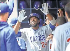  ?? BENNY SIEU, USA TODAY SPORTS ?? Cubs manager Joe Maddon says of outfielder and leadoff man Dexter Fowler, center, “He’s been invaluable.”