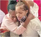  ?? [ALYSSA POINTER/ATLANTA JOURNAL-CONSTITUTI­ON] ?? Charmaine Turner, right, mother of Secoriea Turner, is comforted by her mother, Shanta Turner, as she becomes emotional during the service Wednesday for the 8-year-old girl at New Calvary Missionary Church in Atlanta’s Sylvan Hills community. Secoriea was shot dead by armed civilians July 4 in Atlanta.