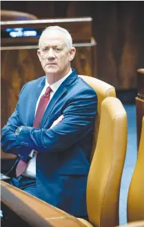  ?? (Yonatan Sindel/Flash90) ?? MK BENNY Gantz observes in the Knesset, on the day of the new government’s inaugurati­on last month.