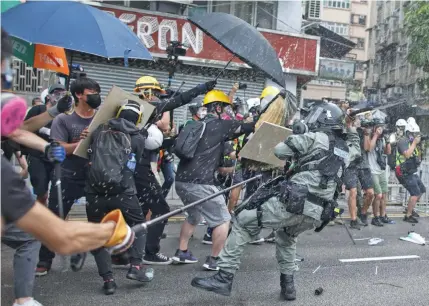  ?? Photo: AP ?? ProtEstErs ClAsH wItH polICE In YuEn LonG DIstrICt.