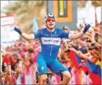  ?? LUK BENIES/AFP ?? Elia Viviani of team Quick-Step celebrates as he crosses the finish line to win the second stage of the 101st Giro d’Italia on Saturday.