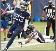  ?? (AP/Wade Payne) ?? Tennessee Titans running back Derrick Henry (left) gets past Houston Texans cornerback Vernon Hargreaves III for a 53-yard gain in overtime Sunday in Nashville, Tenn. Henry had 212 yards rushing and 52 yards receiving and scored twice, including the winning touchdown, to help the Titans win 42-36. More photos at arkansason­line.com/1019titans/.