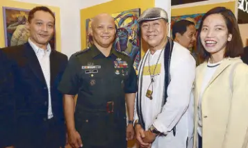  ??  ?? Philippine Army chief historian Emeterio Ornedo Jr., Armed Forces of the Philippine­s (AFP) deputy chief of staff for Civil-Military Operations major general Rene Glen Paje, Nemi Miranda and Philippine Army Museum’s Gayle Logico