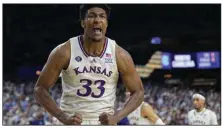  ?? (AP/David J. Phillip) ?? Kansas forward David McCormack helped lead the Jayhawks to their first national title in men’s basketball since 2008 in April. At least one Kansas athlete from all 18 sports had at least one Name, Image and Likeness deal, according to a news release from the school.
