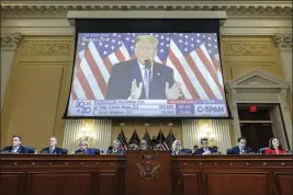  ?? ALEX WONG — POOL PHOTO ?? A video of then-President Donald Trump speaking is displayed as the House select committee investigat­ing the Jan. 6attack holds a hearing on Capitol Hill in Washington on Thursday.