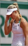  ?? Associated Press photo ?? Germany's Angelique Kerber reacts after missing a shot when losing in two sets, 2-6, 2-6, against Russia's Ekaterina Makarova at the French Open tennis tournament at the Roland Garros stadium in Paris, France, Sunday.