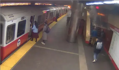  ?? MBTA VIDEO SCREENGRAB. ?? A 25-pound ceiling tile falls at the Harvard Red Line station just missing a rider. See the video at bostonhera­ld.com.