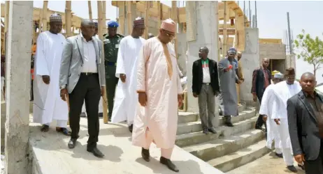  ?? Photo: Yobe Govt. House ?? Governor Ibrahim Gaidam of Yobe State (3rd left) and other officials inspect a section of the Yobe University Medical College Complex currently under constructi­on by his administra­tion at the Yobe State University in Damaturu yesterday