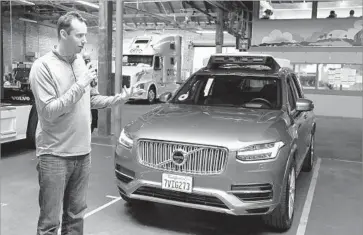  ?? Eric Risberg Associated Press ?? ANTHONY LEVANDOWSK­I, head of Uber’s self-driving car program, talks about the San Francisco company’s driverless cars in December. He is accused in a lawsuit of stealing trade secrets from Google’s Waymo.