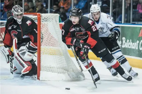  ?? VICTORIA TIMES-COLONIST PHOTO BY DARREN STONE ?? Dennis Cholowski carries the puck away from Jeremy Masella of the Victoria Royals during a Dec. 27 game in Victoria.