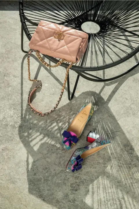  ??  ?? C19 bag, price on request, Chanel. Shoes, Dh2,990, Christian Louboutin Opposite page, dress, Dh13,690; and bag, Dh8,390, both from Fendi
For stockist details, see page 48
