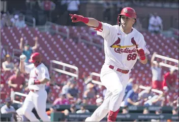  ?? JEFF ROBERSON — THE ASSOCIATED PRESS ?? St. Louis’ Lars Nootbaar runs after hitting a walk-off single as Paul Goldschmid­t, left, comes in to score the winning run.