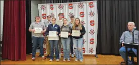  ?? David Jacobs/sdg Newspapers ?? Here’s a look at the Shelby High School students on hand at the school board meeting where they were honored Feb. 19 for their achievemen­ts on the ACT. In the first row are Eli Schwemley, Cadence Fairchild, Lillian Heydinger, and Sadie Howarth. In the back row are Russell Cole, Toby Randall and Luke Lesseuer.