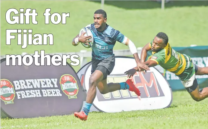  ?? Picture: ELIKI NUKUTABU ?? Fiji 7s halfback Filipo Bukayaro beats a Malomalo player during the Fiji Bitter Malomalo 7s at Lawaqa Park, Sigatoka, last Friday.