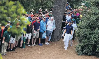  ?? PHOTO: GETTY IMAGES ?? Showing the way . . . Jordan Spieth of the United States walks out of the bushes on the 18th hole during the first round of the 2018 Masters Tournament at Augusta National Golf Club yesterday.