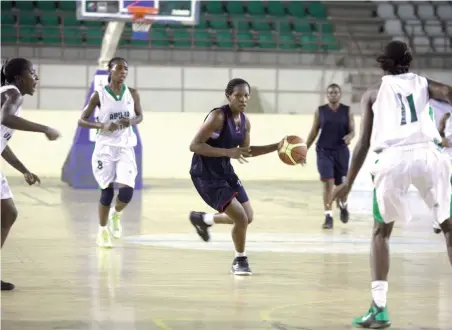  ?? PHOTO
GODSWILL AYEMOBA ?? Customs player (11) Egbe H. drivers through he FCT Queens guard during the 10th Zenith Bank National Women Basketball league in Abuja.