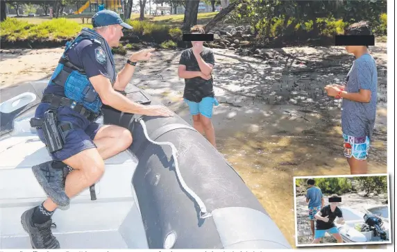  ??  ?? Water police officer Sargent Tony Nelson speaks to two teenagers after they were caught hooning in their tinnies. Pictures: MIKE BATTERHAM