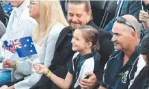  ??  ?? A young supporter at yesterday’s Currumbin service.